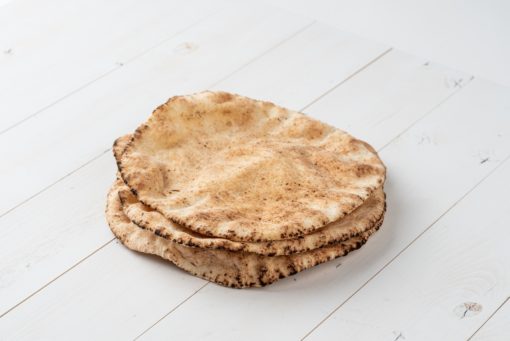 Alternative Plain Pita Bread on White Wooden Board